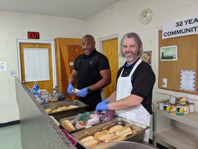 OTRS employees help at Dorothy Day Soup Kitchen with making sandwiches