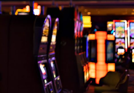 inside a gambling hall, blurred one arm machines