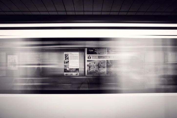 Ads visible through windows of a speeding train